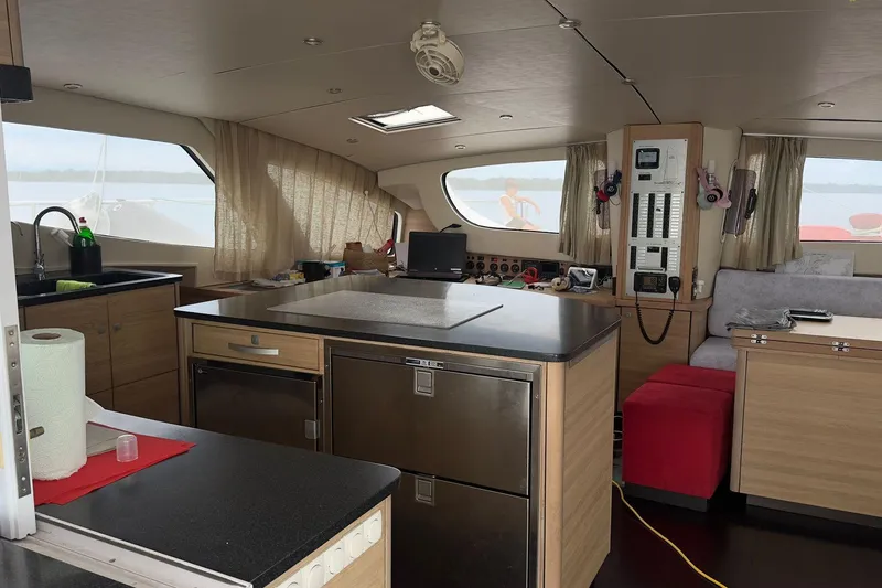 Manila Spirit Yacht Photos Pics Interior of a 2012 Dean 5000 yacht with modern kitchen and navigation equipment.