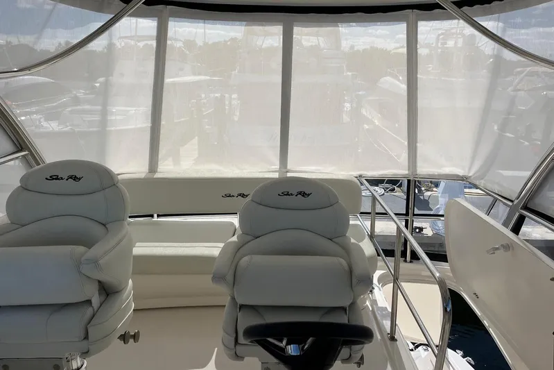 N/a Yacht Photos Pics Interior of 2006 Sea Ray 52 Sedan Bridge with white seating and helm.