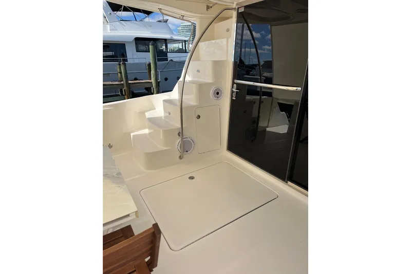 N/a Yacht Photos Pics 2006 Sea Ray 52 Sedan Bridge yacht deck with stairs and glass door.