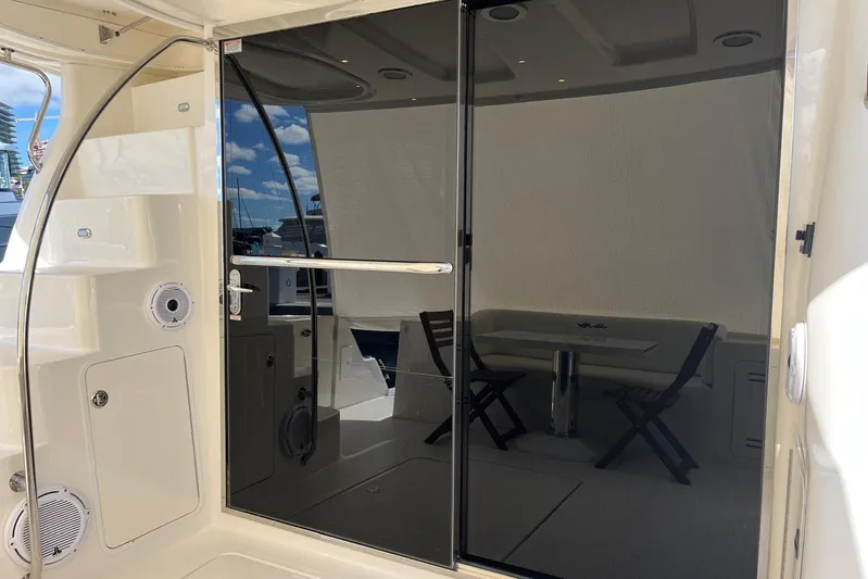 N/a Yacht Photos Pics 2006 Sea Ray 52 Sedan Bridge yacht with sleek glass door and outdoor seating.