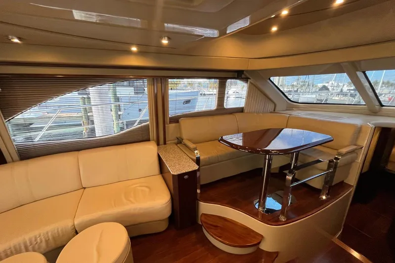 N/a Yacht Photos Pics Luxurious interior of a 2006 Sea Ray 52 Sedan Bridge yacht with elegant seating and table.