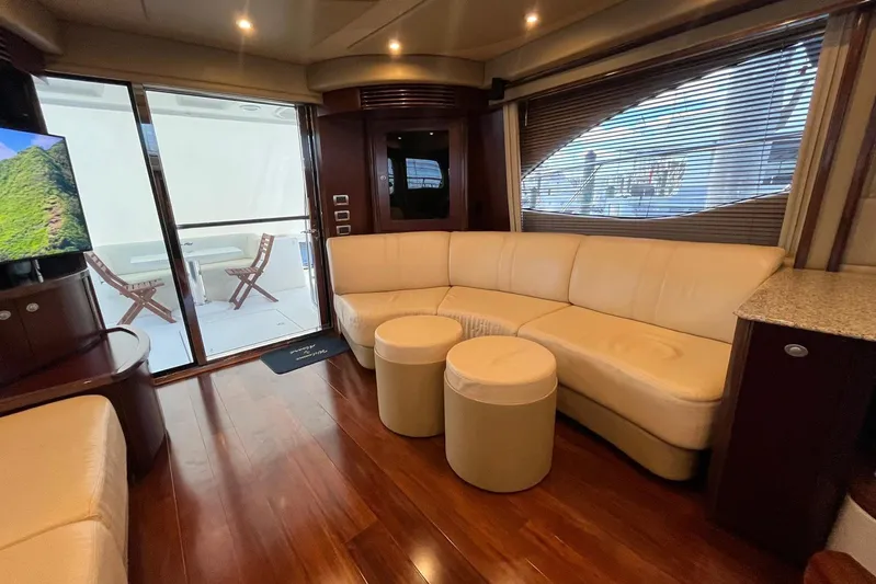 N/a Yacht Photos Pics Luxurious interior of 2006 Sea Ray 52 Sedan Bridge yacht with leather seating and wood flooring.