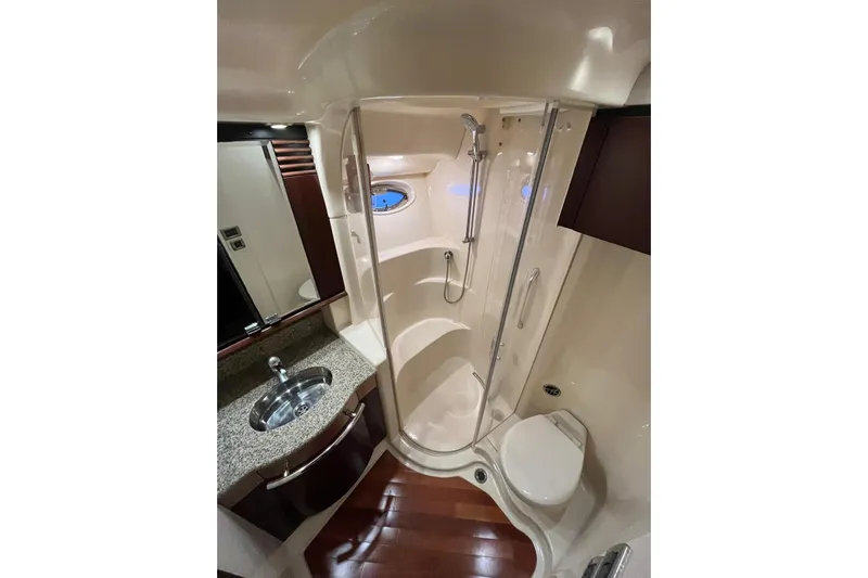 N/a Yacht Photos Pics Luxurious bathroom in 2006 Sea Ray 52 Sedan Bridge yacht with shower, sink, and toilet.