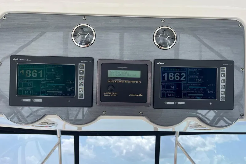 N/a Yacht Photos Pics Control panel of a 2006 Sea Ray 52 Sedan Bridge with digital displays and gauges.