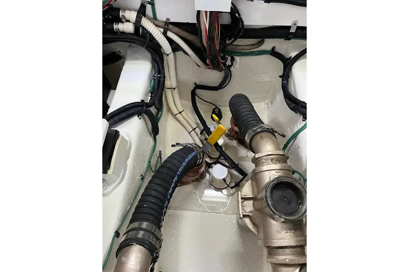 N/a Yacht Photos Pics Engine room of 2006 Sea Ray 52 Sedan Bridge with visible hoses and fittings.