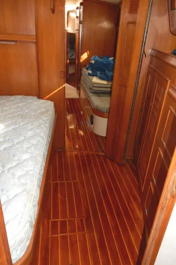 Tilikum III Yacht Photos Pics Interior of 1997 Island Packet 40 sailboat with wooden flooring and cozy cabin layout.