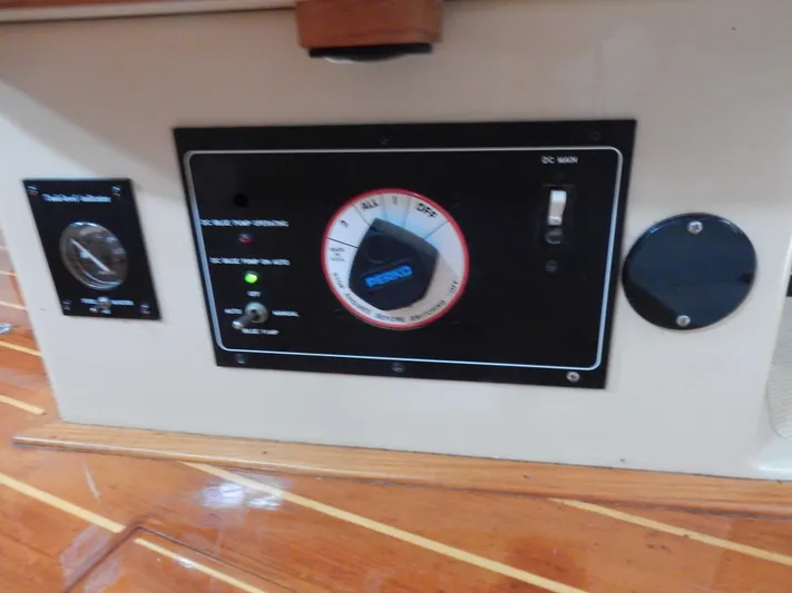 Tilikum III Yacht Photos Pics Control panel on 1997 Island Packet 40 yacht with wooden flooring.