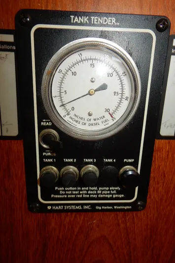 Tilikum III Yacht Photos Pics Tank Tender gauge on 1997 Island Packet 40 sailboat, showing water and diesel fuel levels.