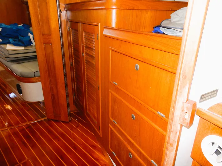 Tilikum III Yacht Photos Pics Interior of 1997 Island Packet 40 sailboat with wooden cabinetry and flooring.