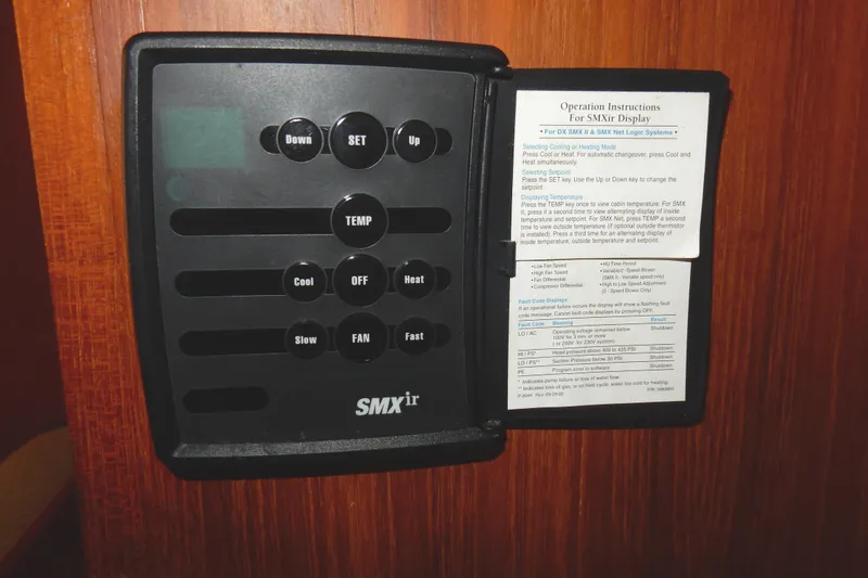 Tilikum III Yacht Photos Pics Control panel of a 1997 Island Packet 40 sailboat with operation instructions.