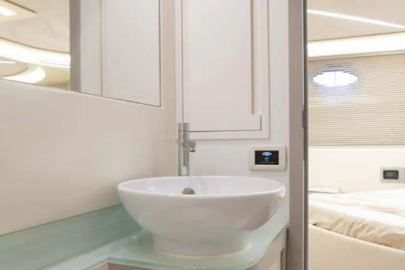  Yacht Photos Pics Luxurious bathroom interior of 2005 Pershing 62 yacht with modern sink and sleek design.