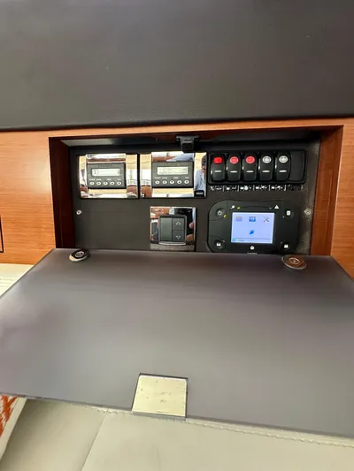 "freedom" Yacht Photos Pics Control panel of a 2016 Jeanneau NC 14 boat with switches and display.