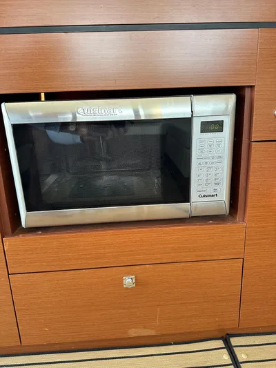 "freedom" Yacht Photos Pics Built-in Cuisinart microwave in 2016 Jeanneau NC 14 yacht kitchen.