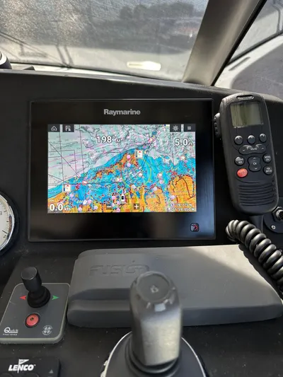 "freedom" Yacht Photos Pics Raymarine navigation system on 2016 Jeanneau NC 14 boat dashboard.
