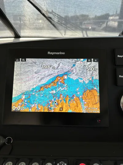 "freedom" Yacht Photos Pics Raymarine navigation display on 2016 Jeanneau NC 14 boat, showing nautical chart.