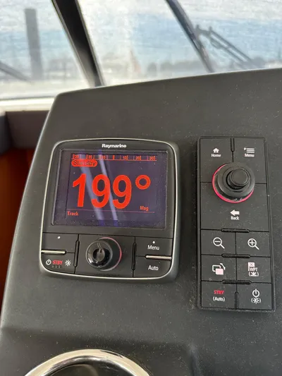 "freedom" Yacht Photos Pics Control panel of a 2016 Jeanneau NC 14 boat showing a 199-degree heading.