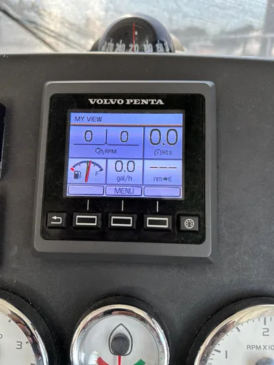 "freedom" Yacht Photos Pics Volvo Penta display on 2016 Jeanneau NC 14 boat dashboard showing engine metrics.