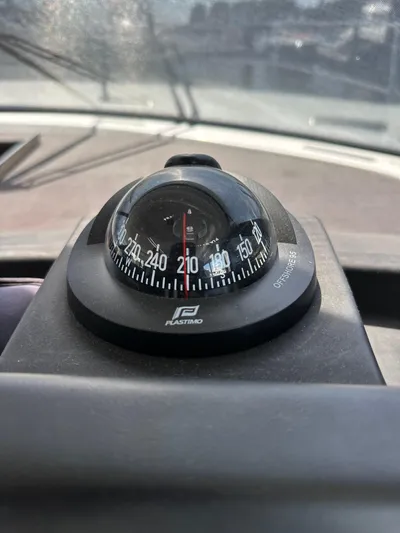 "freedom" Yacht Photos Pics Compass on Jeanneau NC 14 boat, 2016 model, showing heading of 210 degrees.