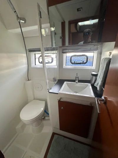 "freedom" Yacht Photos Pics 2016 Jeanneau NC 14 bathroom with modern fixtures and natural light.