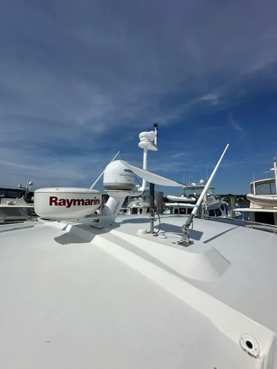"freedom" Yacht Photos Pics Radar equipment on 2016 Jeanneau NC 14 boat under clear blue sky.