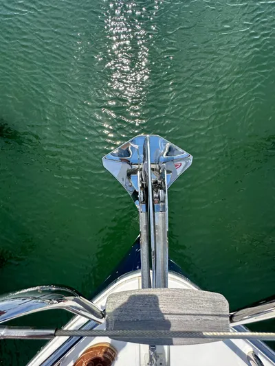 "freedom" Yacht Photos Pics Bow view of 2016 Jeanneau NC 14 yacht on green water.