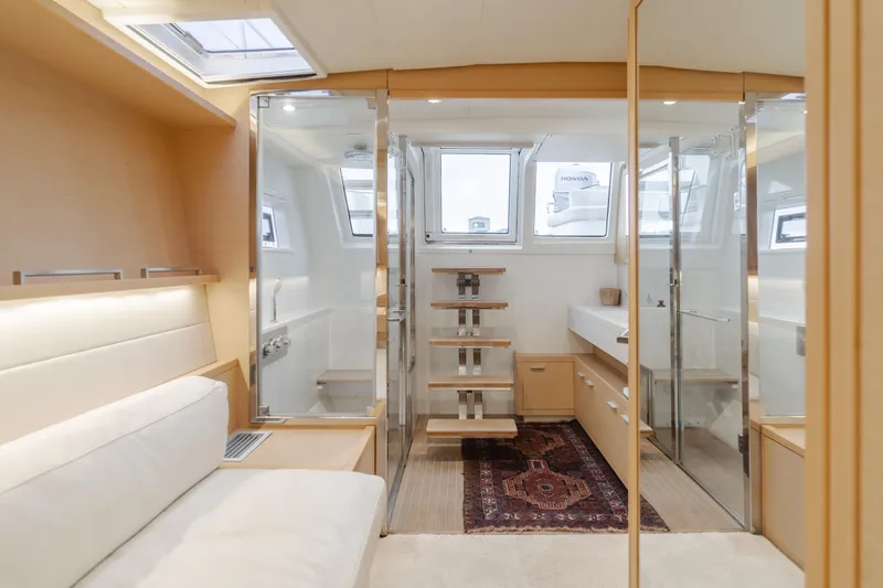 Sunset O Yacht Photos Pics Luxurious interior of 2019 Lagoon 620 yacht with modern design and natural light.