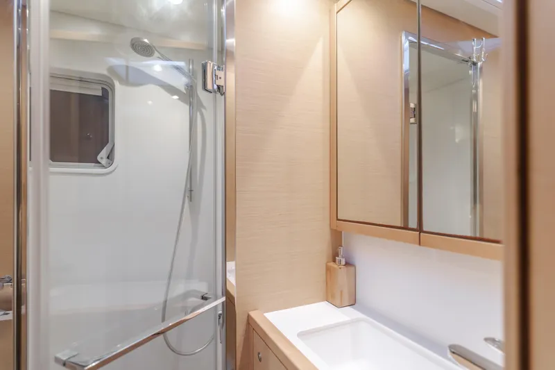Sunset O Yacht Photos Pics Luxurious bathroom in 2019 Lagoon 620 yacht with modern shower and vanity.