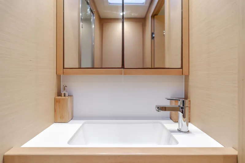 Sunset O Yacht Photos Pics Modern bathroom sink with mirror on Lagoon 620 yacht, 2019 model.