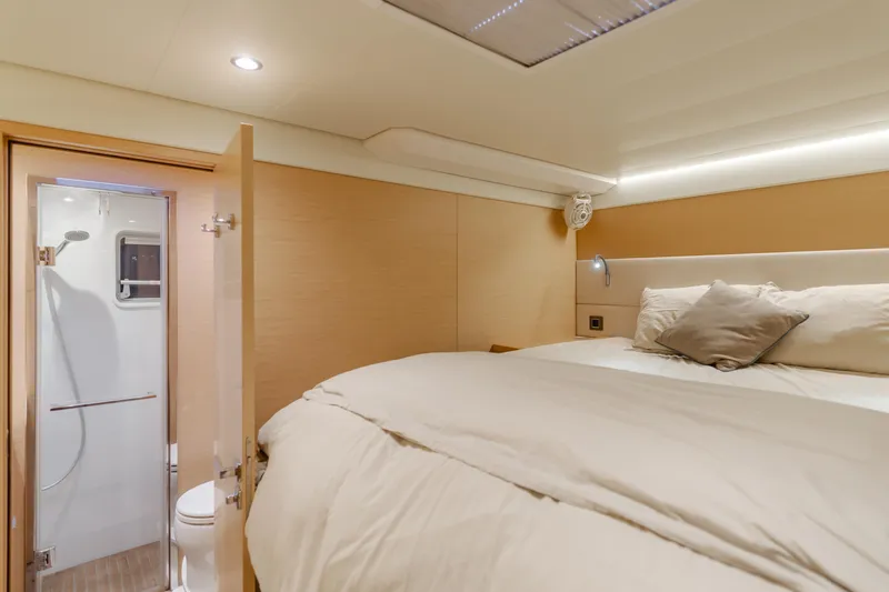 Sunset O Yacht Photos Pics Luxurious cabin interior of 2019 Lagoon 620 yacht with ensuite bathroom.