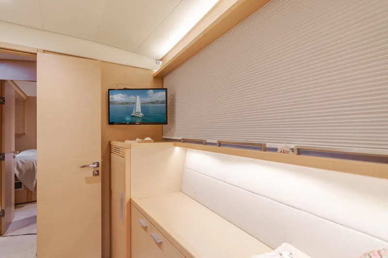 Sunset O Yacht Photos Pics Interior of 2019 Lagoon 620 yacht cabin with TV and modern furnishings.