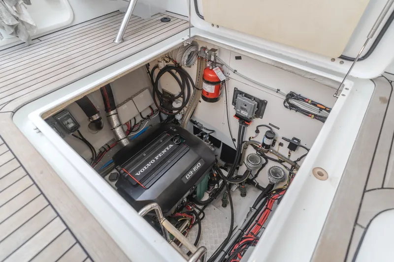 Sunset O Yacht Photos Pics Engine compartment of a 2019 Lagoon 620 yacht, featuring a Volvo Penta engine and safety equipment.