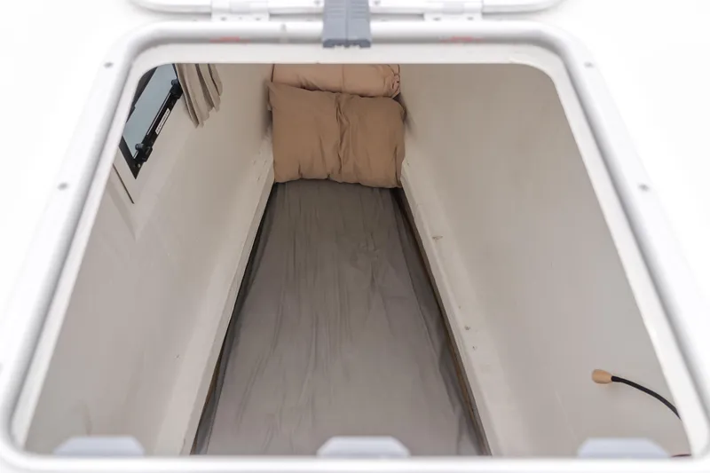 Sunset O Yacht Photos Pics Interior view of a 2019 Lagoon 620 yacht cabin with bedding.