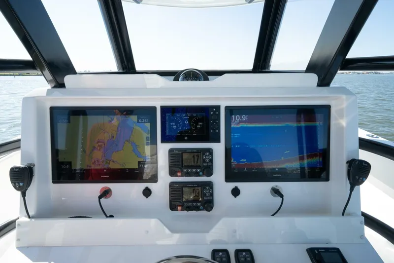  Yacht Photos Pics Control panel of 2021 Invincible 35 Catamaran with navigation and communication systems.