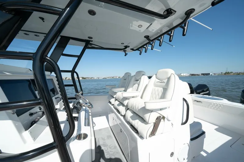  Yacht Photos Pics 2021 Invincible 35 Catamaran interior with luxurious seating and modern controls on open water.