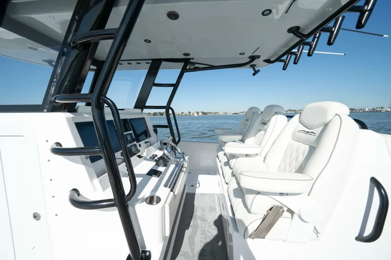  Yacht Photos Pics 2021 Invincible 35 Catamaran interior with modern helm and luxurious seating on open water.