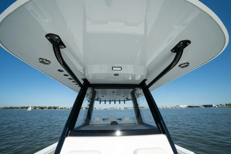  Yacht Photos Pics 2021 Invincible 35 Catamaran on water, showcasing sleek design and sturdy structure.