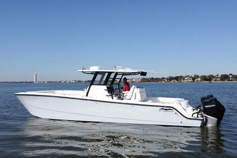  Yacht Photos Pics 2021 Invincible 35 Catamaran on calm water, featuring sleek design and Mercury outboard engine.