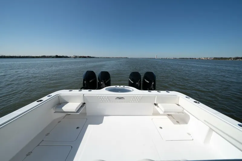  Yacht Photos Pics 2021 Invincible 35 Catamaran on open water, showcasing spacious deck and powerful engines.