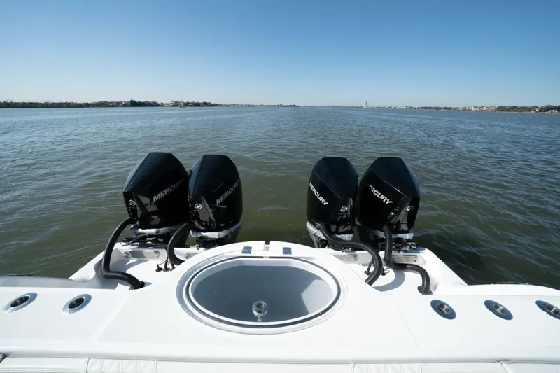  Yacht Photos Pics 2021 Invincible 35 Catamaran with four Mercury engines on open water.