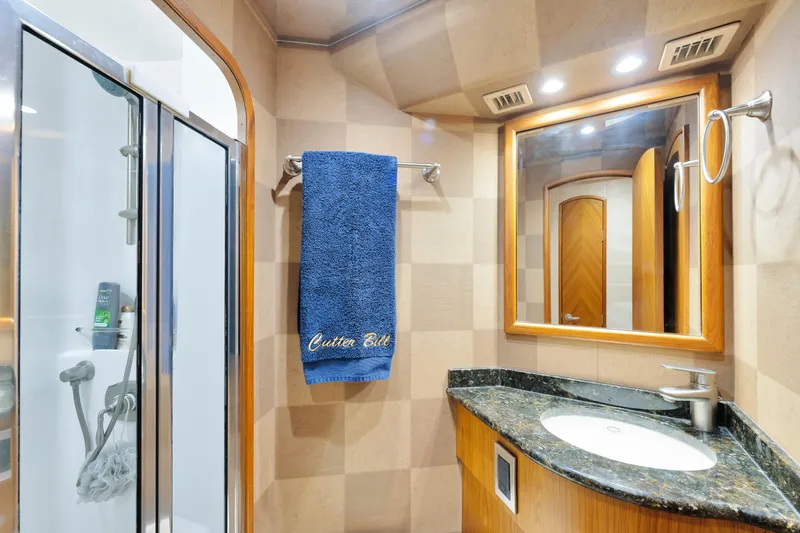 Cutter Bill Yacht Photos Pics Luxurious bathroom in 2011 Viking 70 Convertible yacht with shower and elegant vanity.