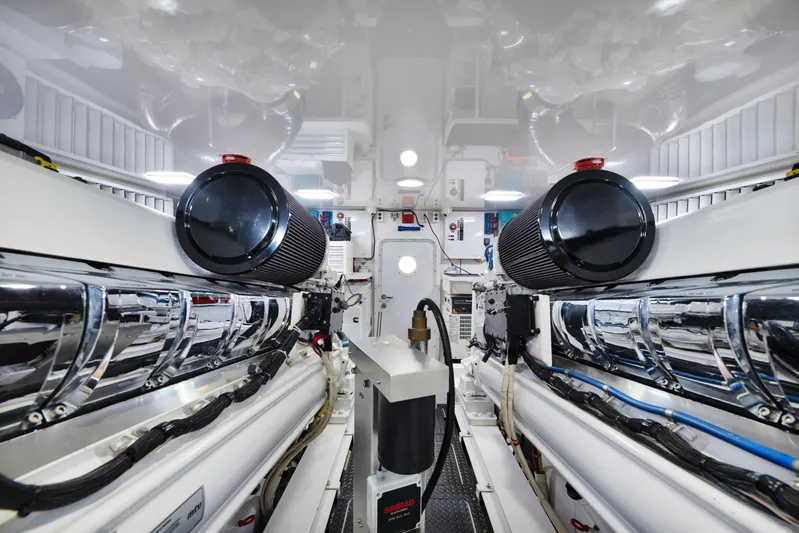 Cutter Bill Yacht Photos Pics Engine room of 2011 Viking 70 Convertible yacht, featuring dual engines and sleek design.