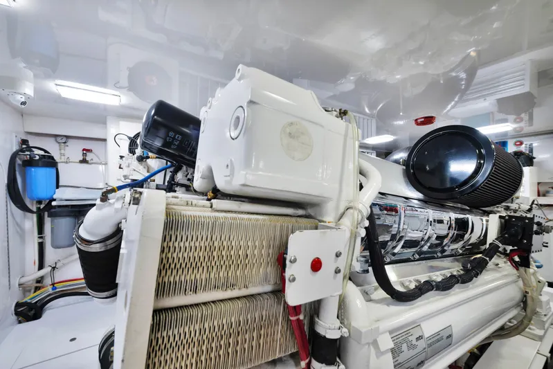 Cutter Bill Yacht Photos Pics Engine room of 2011 Viking 70 Convertible yacht, showcasing advanced machinery and components.