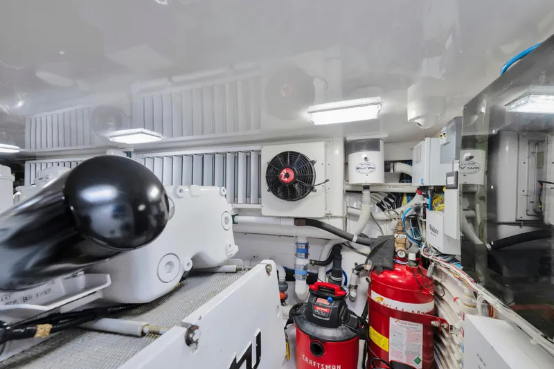 Cutter Bill Yacht Photos Pics Engine room of 2011 Viking 70 Convertible yacht with equipment and machinery.