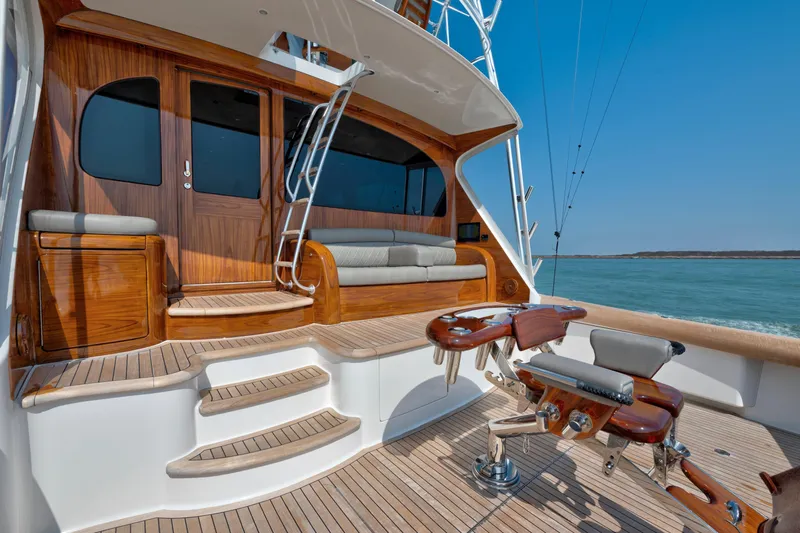 Cutter Bill Yacht Photos Pics Luxurious 2011 Viking 70 Convertible yacht deck with wooden finishes and ocean view.