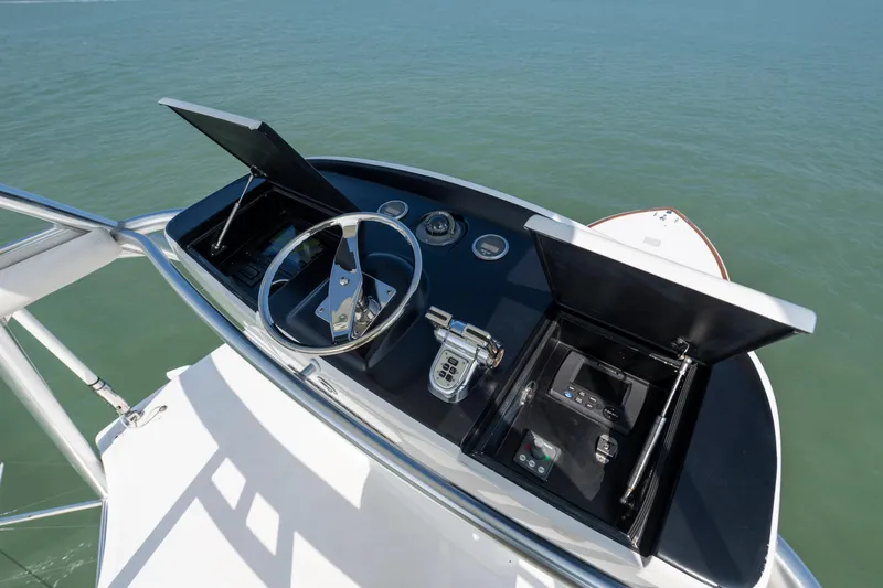 Cutter Bill Yacht Photos Pics Helm of 2011 Viking 70 Convertible yacht with steering wheel and control panels.