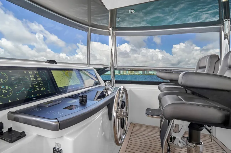Surplus Lines Yacht Photos Pics Luxurious helm of 2019 Hatteras M90 Panacera yacht with advanced navigation displays.