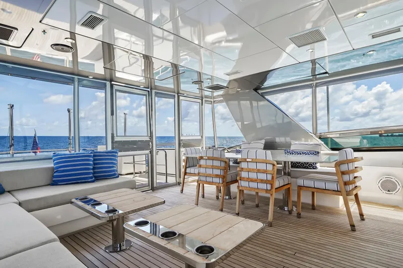 Surplus Lines Yacht Photos Pics Luxurious interior of 2019 Hatteras M90 Panacera yacht with ocean view and elegant seating.