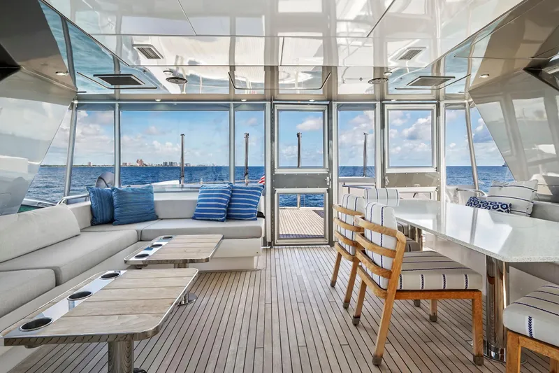 Surplus Lines Yacht Photos Pics Luxurious interior of 2019 Hatteras M90 Panacera yacht with ocean view and elegant seating.