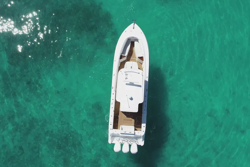 Aquamarine Yacht Photos Pics Aerial view of 2019 HCB 39 Speciale boat on clear turquoise water.