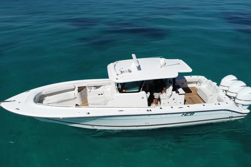 Aquamarine Yacht Photos Pics 2019 HCB 39 Speciale boat cruising on clear blue water.